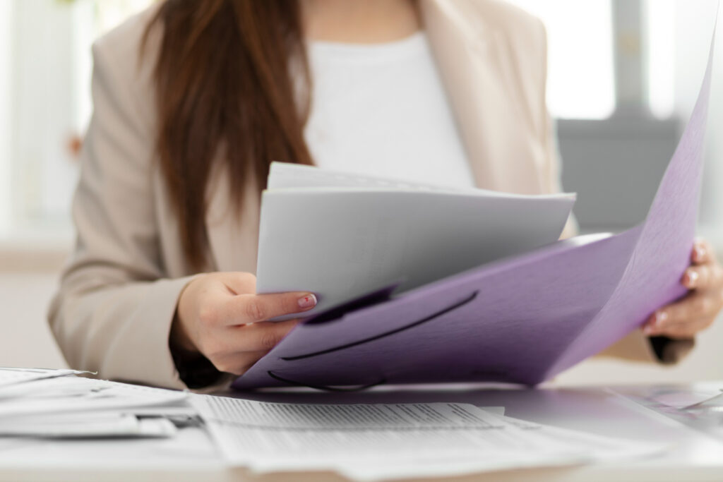 Businesswoman reviewing documents in Adelaide.