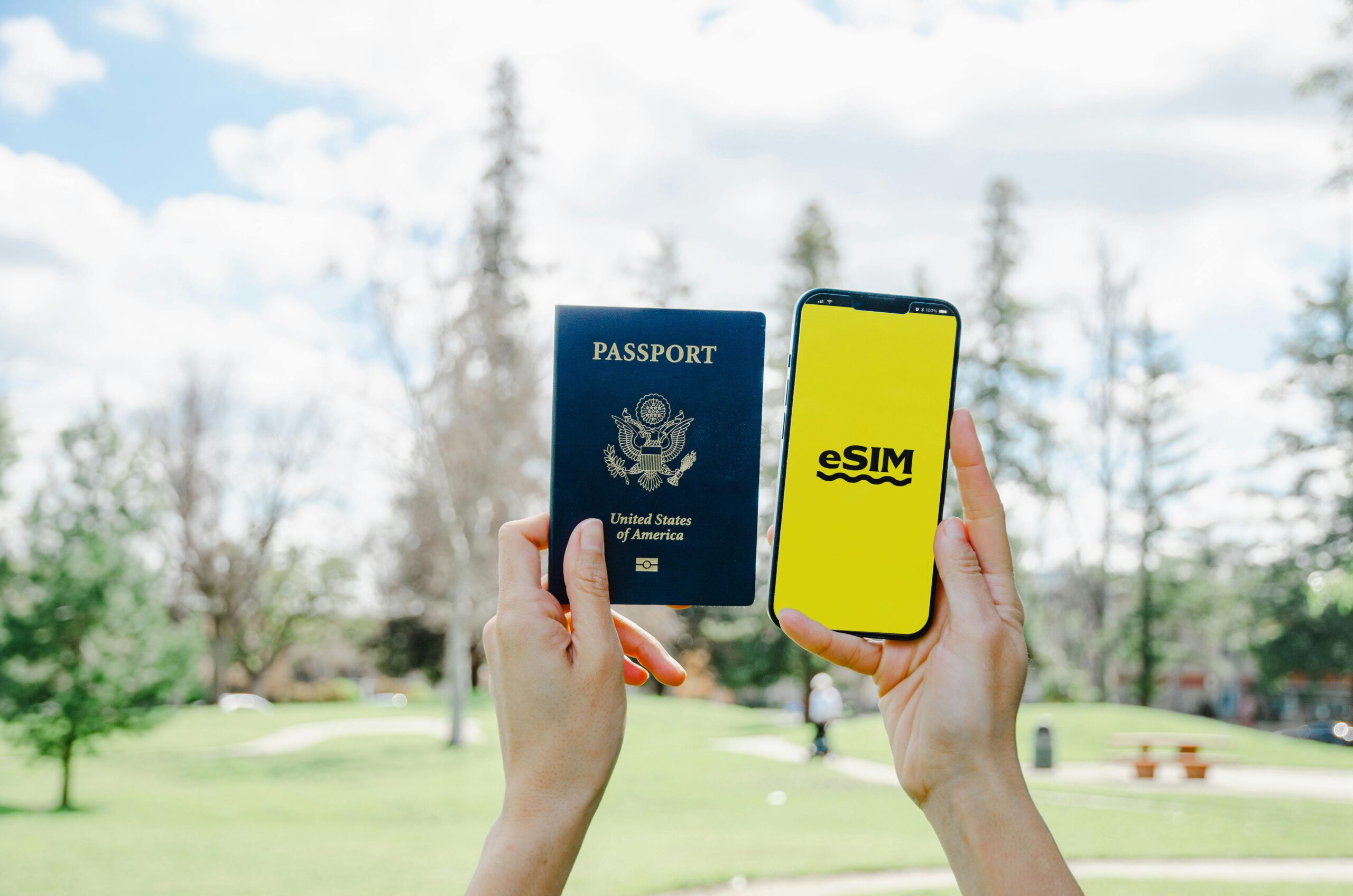 Passport and phone displaying eSIM app.