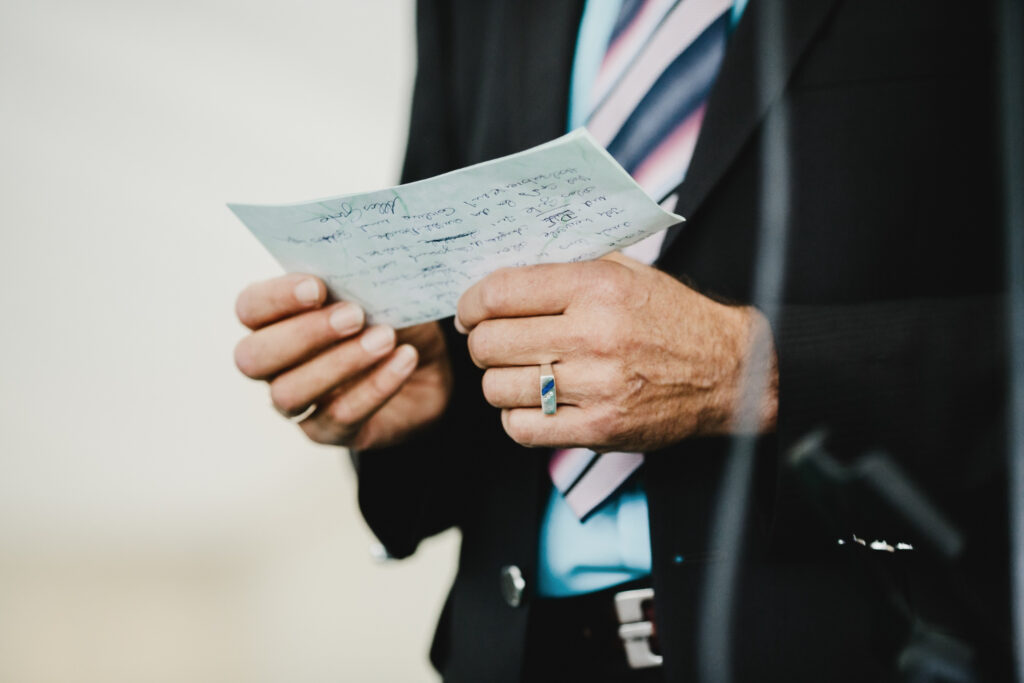 Man reviewing immigration paperwork, seeking ministerial intervention.