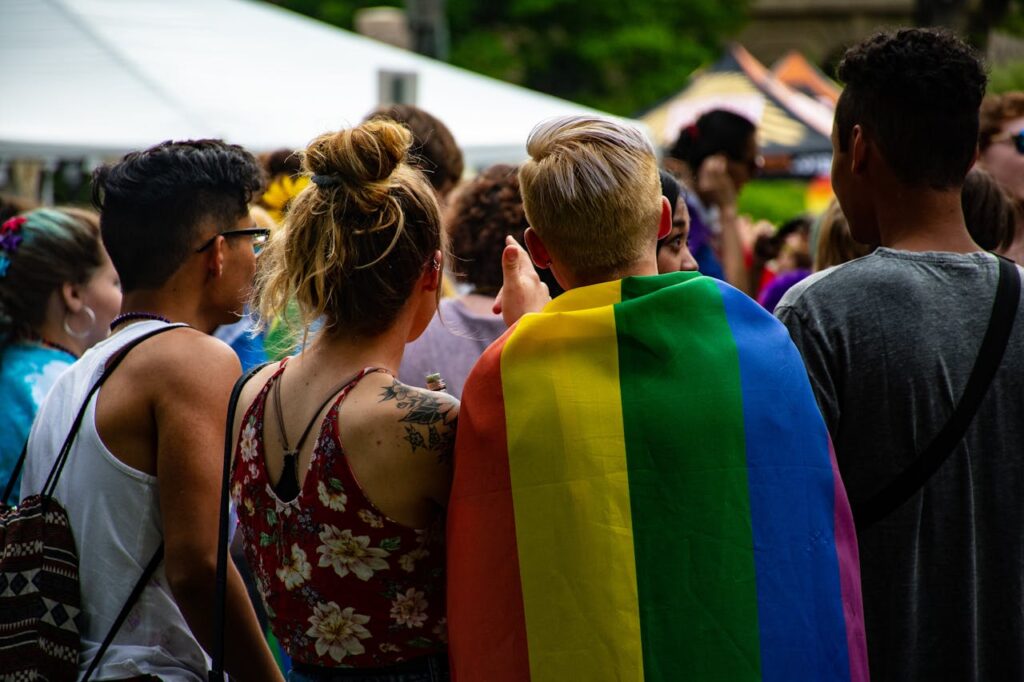 LGBTIQ+ couple at a pride event, celebrating their relationship.