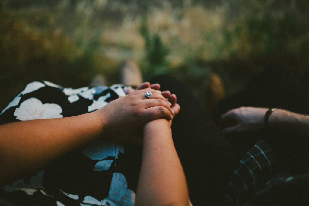 Couple holding hands, engagement ring visible. Prospective marriage visa.