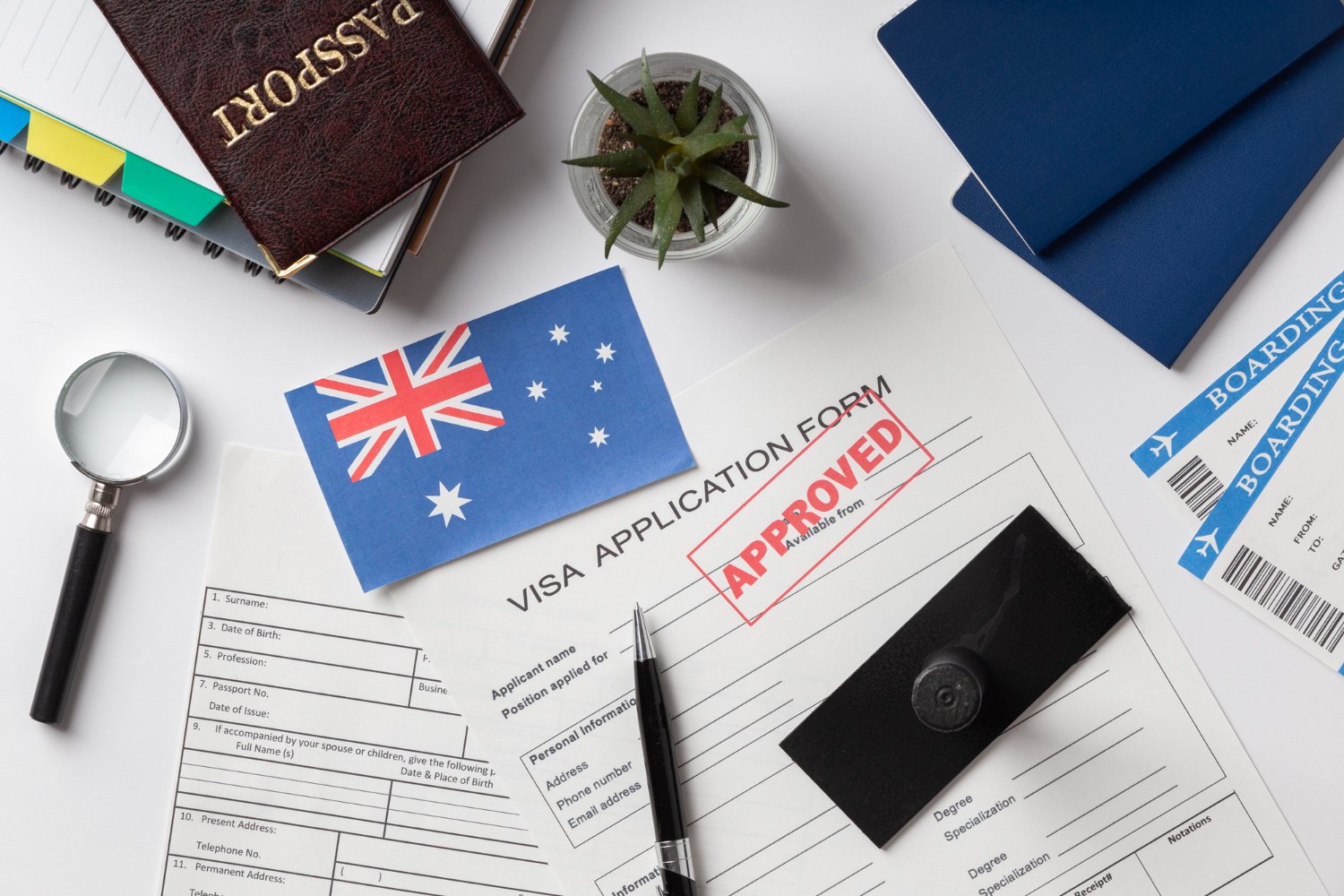 Approved Australian visa application with passport, boarding pass, and Australian flag.
