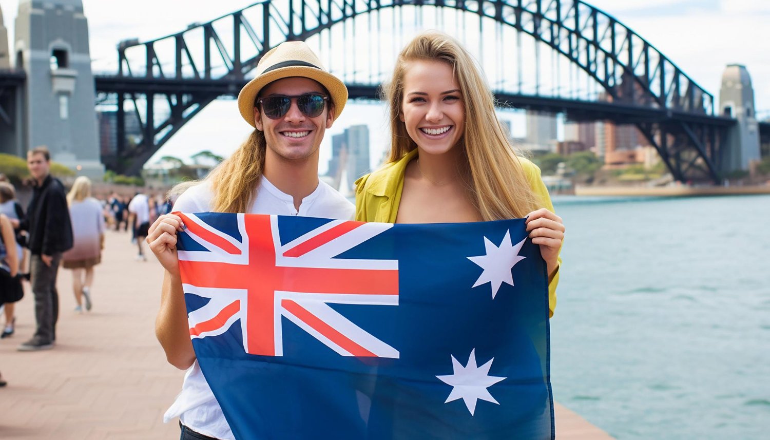 Tourists holding Australian flag in front of Sydney Harbour Bridge, representing Australian citizenship.